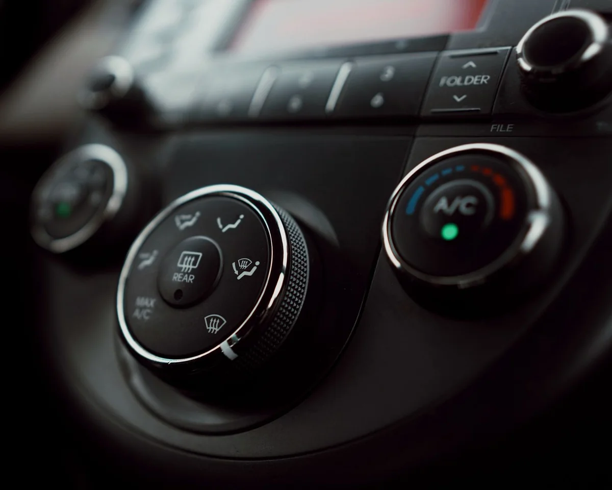 Car temperature and air conditioning controls — illustrative service photograph